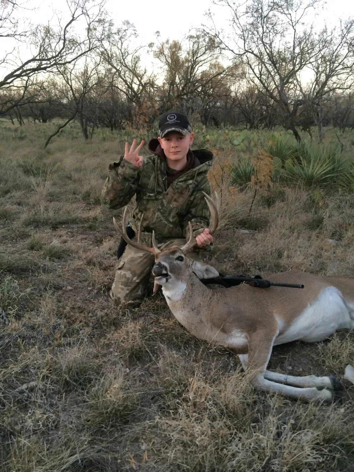 Buck in winter brush with visible breath